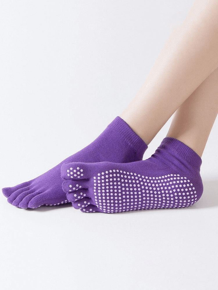 Purple women's five-toe yoga socks with non-slip soles and quick-drying fabric, perfect for fitness and comfort.
